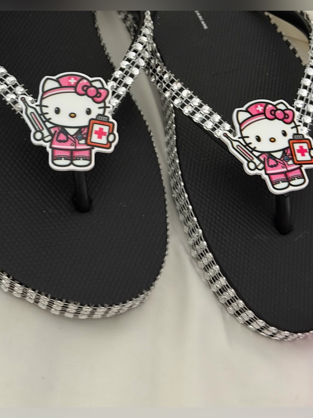 Hello Kitty Black Flip Flop Sandals with Pink Nurse Charm